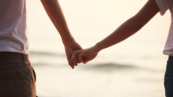 Close up of couple holding hands; Shutterstock ID 127361729; PO: Brandon for Trending